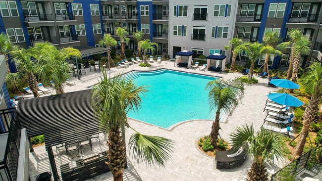 Experience resort-style living with this stunning poolside retreat, perfect for relaxation. - The Jack