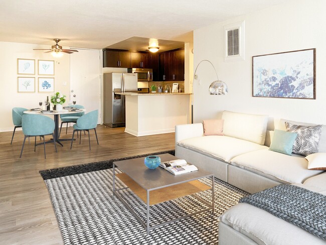 Living room, dining area, and kitchen at Mediterranean Village Apartment Homes - Mediterranean Village West Hollywood