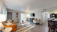 Located at 1785 Main St in the charming city of Dunedin, Florida, this well-appointed one-bedroom, one-bathroom residence offers a thoughtfully designed single-floor layout. The open-concept living and dining area is bathed in natural light, courtesy of large windows and a sliding glass door that opens to the outdoors. Wood-style plank flooring runs throughout the main living spaces, complementing the neutral wall tones and textured ceiling. The galley-style kitchen is efficiently organized, featuring dark cabinetry paired with granite-look countertops, a mosaic tile backsplash, and black appliances, creating a sleek, functional workspace. A hallway connects the main living area to the private quarters, which include a dedicated closet for added storage. The generously sized bedroom is highlighted by a striking teal accent wall, plush carpeting, and dual windows dressed with light-filtering curtains that invite natural light while maintaining privacy. The full bathroom continues the cohesive design aesthetic with wood-style flooring, a dark vanity topped with a speckled granite countertop, soft blue-green walls, and a tub-shower combination. This residence offers a comfortable and stylish living experience in one of Florida's most welcoming coastal communities.