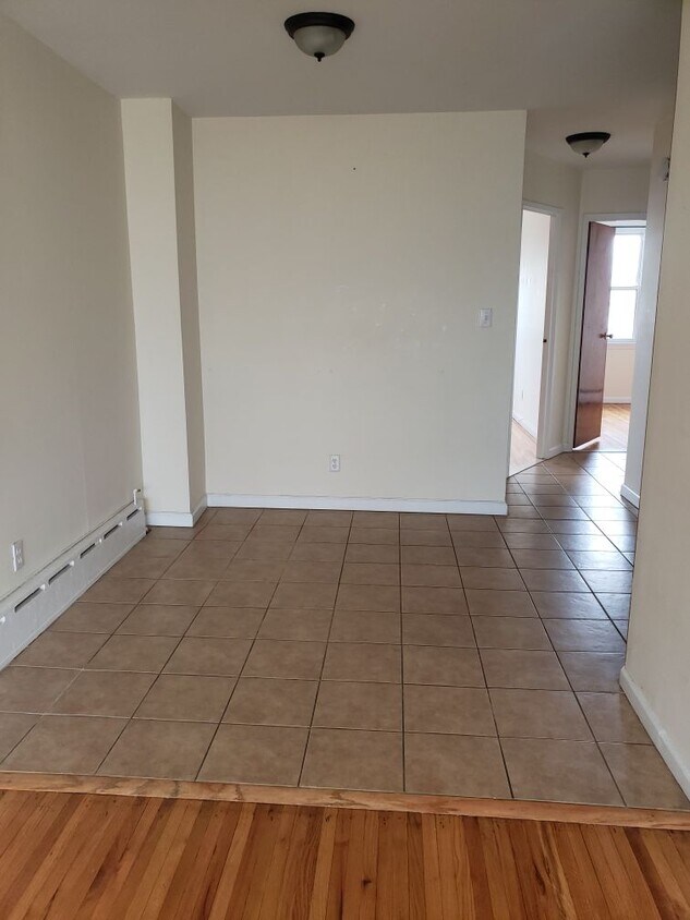 Dining room with hallway leading to bedrooms - 73-24 68th Rd