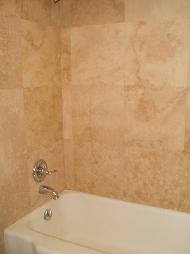 Bath Tub with Marble Walls - Park Plaza Apartments