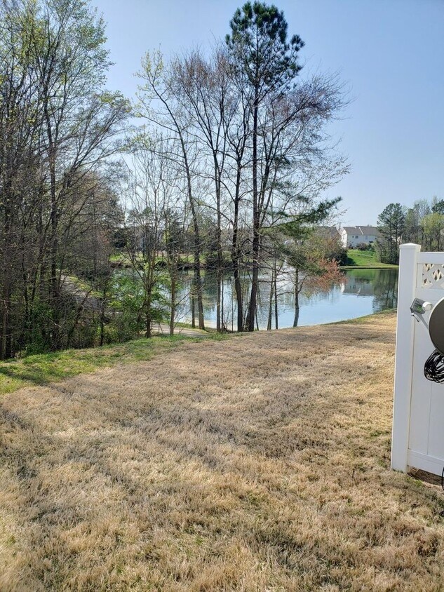 outdoor area bordering scenic pond - 2527 Early Flight Dr