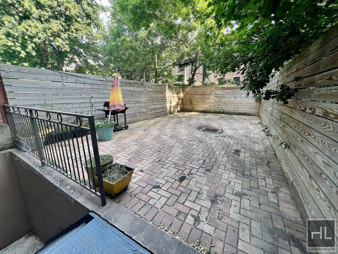 Primary Photo - Ground level brownstone duplex w/ private ...
