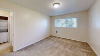 This 860 square foot apartment, located in Gresham, Oregon, offers a comfortable and modern living space. The unit features two bedrooms and two bathrooms, providing ample room for residents. The primary bedroom is generously sized at 150 square feet, ensuring a spacious retreat.

The kitchen is a highlight, boasting wooden cabinetry, granite countertops, and stainless steel appliances. The galley-style layout maximizes efficiency, with ample counter space for meal preparation. Hardwood flooring in the kitchen adds a touch of warmth and elegance.

Both bedrooms are carpeted, creating a cozy atmosphere. Large windows in the bedrooms allow for natural light, brightening the spaces. The bathrooms are well-appointed, with one featuring a shower/tub combination and the other a stand-alone shower, both finished with clean, white tiling.

The apartment's layout includes a hallway for easy navigation between rooms, and a closet for additional storage. A notable feature is the balcony, offering residents an outdoor space to enjoy fresh air and views.

Throughout the apartment, neutral color schemes dominate, providing a blank canvas for personalization. The overall design focuses on functionality and comfort, making it an ideal home for various lifestyles.
