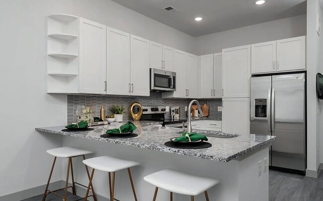 Open Kitchen Layout with White Cabinets and Stainless Steel Appliances - The Harper
