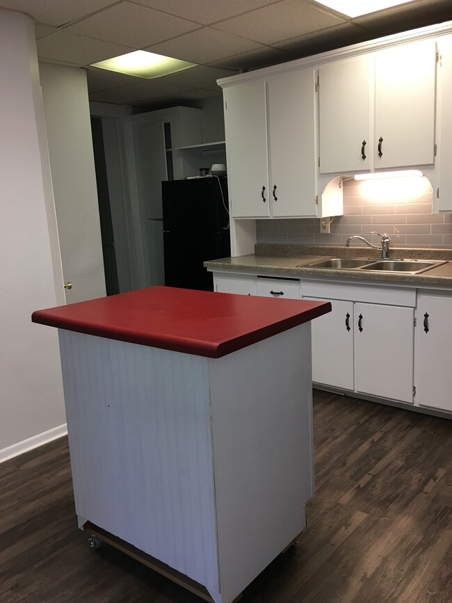 kitchen with island counter - 209 E 4th St