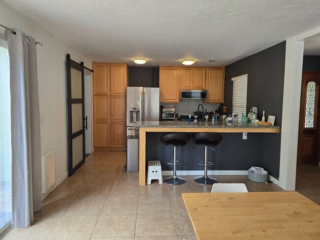 Building Photo - Furnished, 1-Year Long-Term Rental