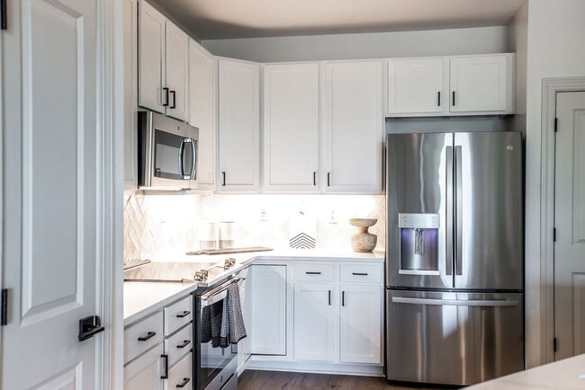 Modern Kitchen with Stainless Steel Appliances and White Cabinetry - The Maggie