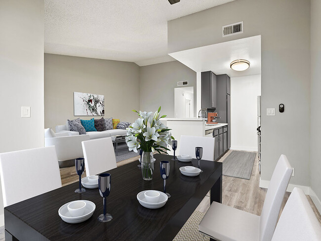 Hardwood floored dining room with view of living room. - Corbin Terrace