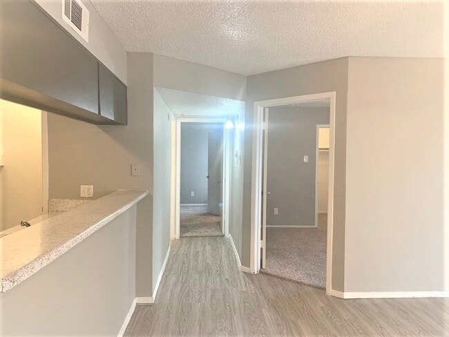 TrinityPark_HallwayViewOfBedrooms - Trinity Park Apartments