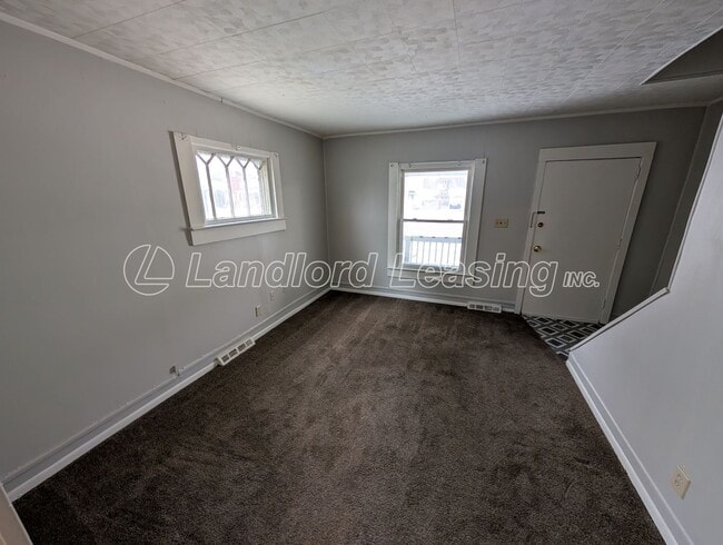Building Photo - Updated Two-Bedroom Townhome with Lawn Care Included