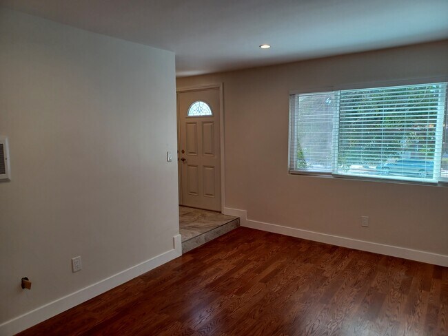 Living room to left of entry door; living room area is also adjacent to dining area - 1911 Grant Ave