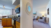 This single-floor residence offers a thoughtfully designed layout that balances comfort and functionality throughout. The kitchen is well-equipped with warm honey-toned cabinetry, dark granite-style countertops, hardwood flooring, and black appliances including an electric range, microwave, and dishwasher — providing ample storage and prep space. Adjacent to the kitchen, the dining area is brightened by a large window with outdoor views of greenery, creating an inviting space for meals. The living room features plush carpeting and a calm, neutral color palette, offering a relaxed atmosphere ideal for everyday living. A decorative circular mirror accents the transitional wall between the kitchen and living areas, adding a stylish touch. The primary bedroom is generously sized with soft carpet, natural light from a large window, and direct access to a walk-in closet and a private en-suite bathroom. The second bedroom is equally comfortable, also featuring carpeted floors, a window, and a walk-in closet. Both bathrooms include warm wood vanities and bathtub/shower combinations. A dedicated in-unit laundry space with a full-size washer and dryer adds everyday convenience to this functional and comfortable home.