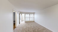 Located at 4367 Riverside Dr in Dayton, Ohio, this 2-bedroom, 2-bathroom unit offers a practical and well-organized single-floor layout. The living area is bright and open, featuring neutral carpeting and large sliding glass doors that lead to a private balcony, allowing natural light to fill the space and providing outdoor views of the surrounding area. Clean white walls and simple, consistent finishes create a cohesive, move-in-ready atmosphere throughout.

The kitchen is equipped with warm wood-toned cabinetry, a double-basin sink, electric range, dishwasher, and durable wood-look flooring. A dedicated pantry or utility door adds additional functionality to the space.

Both bedrooms are carpeted and feature built-in sliding double closets, offering generous storage. The spacious primary bedroom provides ample room for furniture arrangement. The second bedroom is well-sized with a similarly clean and simple design.

The two bathrooms are finished in a clean, all-white palette, each featuring a tub-shower combination with built-in shelving, a single-sink vanity with white cabinetry, and wood-look flooring. A connecting hallway ties the layout together efficiently, making this unit a functional and comfortable residence.