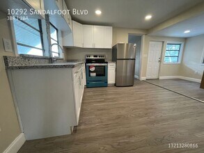 Building Photo - 10292 SW Sandalfoot Blvd