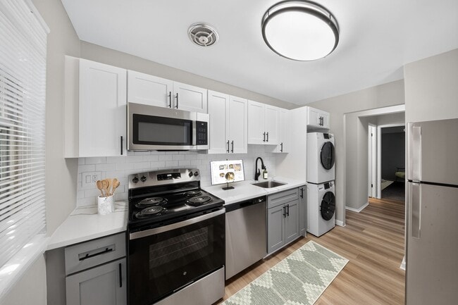 Modern living awaits at Eagle Rock Apartments at Bel Air. This stylish kitchen features sleek stainless steel appliances, ample counter space, and a cozy layout perfect for culinary adventures. Explore your new home today! - Eagle Rock Apartments at Bel Air North