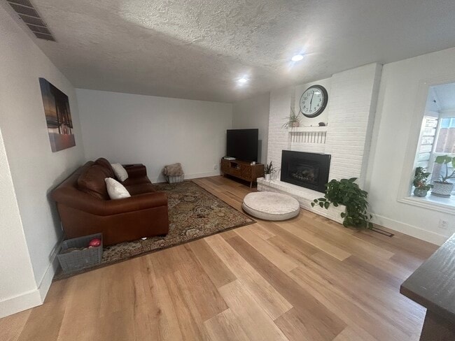 Family room with gas fireplace - 10377 W Alliance St