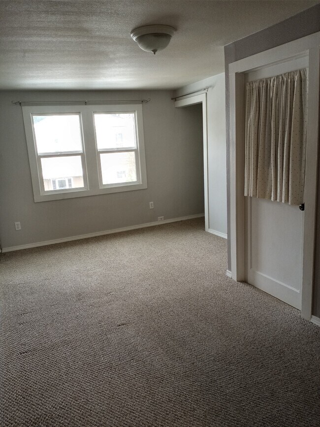 Living room + storage through the door - 2315 15th Ave