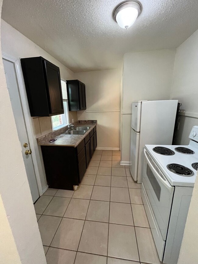 Building Photo - Bright & Spacious Studio Just Minutes from...
