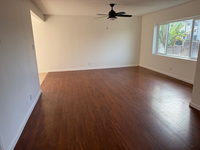 Large living room with natural light - 11954 Eucalyptus Ave Apartments