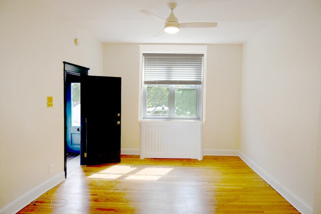 entry with large window south facing with blinds - 217 Fairmount Ave
