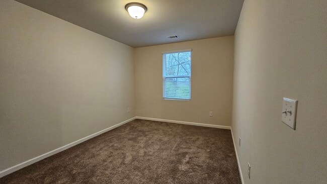 Building Photo - Like NEW townhome located in the sought af...