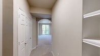 Located at 1520 N Beckley Ave in Dallas, TX, this single-story, 2-bedroom, 2-bathroom home offers a thoughtfully designed layout across a comfortable footprint. The living room is bright and open, featuring plush carpeting, crown molding, and a sliding glass door that leads to an outdoor balcony with tree-lined views, filling the space with natural light. Elegant arched doorways connect the living areas, adding an architectural charm throughout. The kitchen is well-equipped with light wood cabinetry, dark countertops, a center island, a full suite of white appliances, a dishwasher, and a decorative hanging pot rack, all accented by track lighting and wood-look flooring. The primary bedroom is generously sized, offering carpet flooring, a ceiling fan, and a window with outdoor views. Both bathrooms are functional and clean, featuring wood-look flooring, vanities with storage, and tiled shower and tub areas. Closets provide dedicated storage throughout the home. An attached garage with an automatic opener adds convenience. Hallways connect the rooms efficiently, contributing to a practical and cohesive floor plan suited for comfortable everyday living.