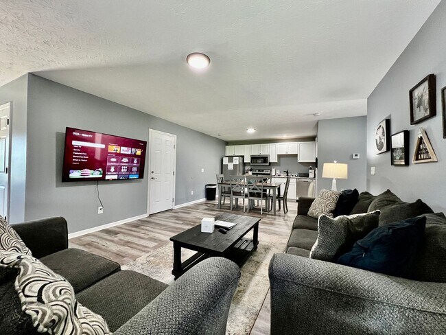 Building Photo - 3 bedroom home w/ privately fenced yard + hot tub.