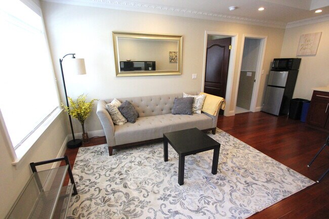 Living area and front door with large window. Lots of natural light. - 309 Rio Verde St
