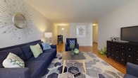 This single-floor residence on Farmington Avenue in West Hartford, CT offers a thoughtfully designed layout with warm hardwood flooring that flows seamlessly throughout the main living spaces. The open-concept floor plan connects the living room, dining area, and kitchen, creating a cohesive and functional environment.

The living room is generously proportioned, featuring warm hardwood floors, bright windows that allow natural light to filter in, and ample space for comfortable seating arrangements. The area opens toward a dedicated dining space, making entertaining straightforward and natural.

The kitchen is efficiently arranged in an L-shaped configuration, outfitted with white cabinetry offering abundant storage, dark granite-style countertops, white appliances including a range and over-the-range microwave, and tile flooring that complements the overall design.

The bedroom is a calm, well-lit retreat with hardwood floors, patterned window treatments, and a spacious built-in closet featuring louvered bifold doors that span an entire wall, providing substantial storage.

The full bathroom is finished with white subway tile wainscoting, a tub-shower combination with a decorative curtain, and neutral tile flooring, maintaining a clean and classic aesthetic throughout.