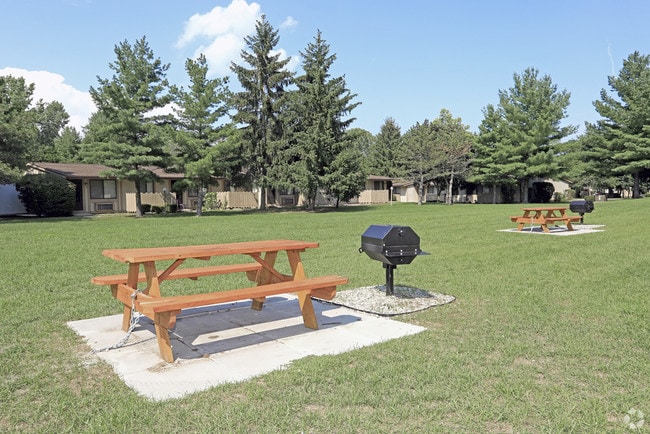 Enjoy serene moments in this exquisite outdoor seating oasis, perfect for gatherings and relaxation. - Westmoore Apartments