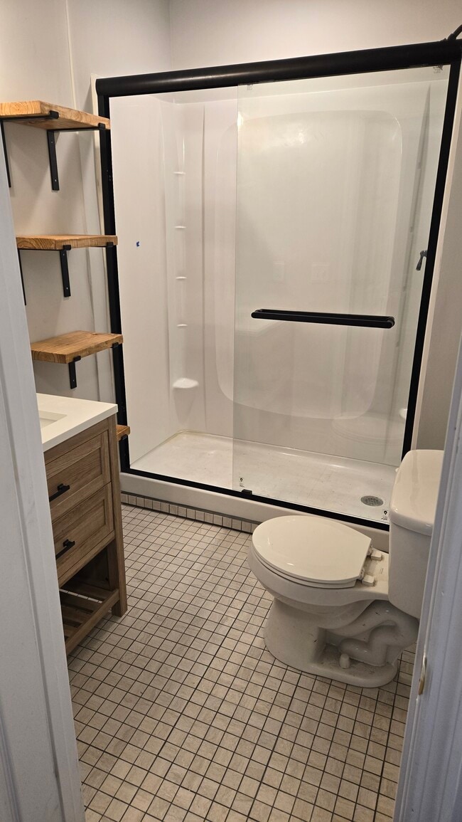 New tile, vanity, shower w/ glass door, modern shelving - 208 Line St
