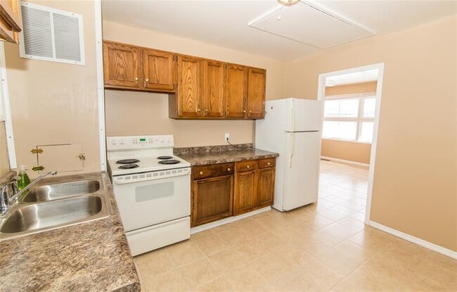 Kitchen has easy to clean tile floors. - 2950 N Ritter Ave