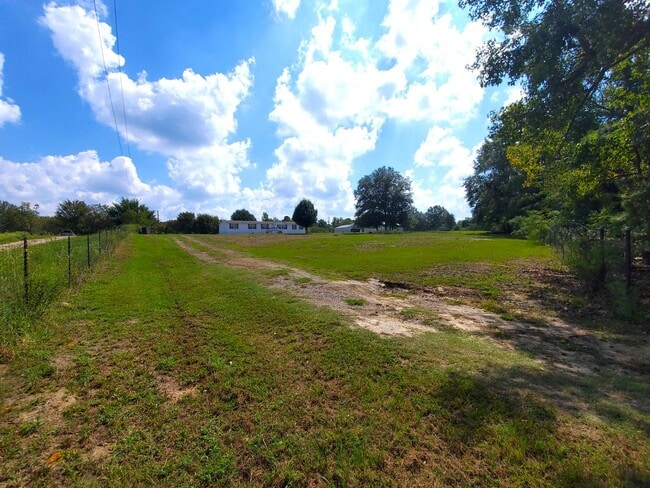 Building Photo - Spacious 4 bedroom with 3 FULL bathrooms nestled on 2 acres! MUST SEE!!!