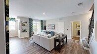 Located at 623 Moti Ct in Ewing, NJ, this well-appointed two-story home offers one bedroom, three full bathrooms, two dedicated office spaces, and a thoughtfully designed layout spread across two floors. The main level opens into a bright, open-concept living, dining, and kitchen area. The living room features rich wood-look flooring, neutral walls, and large windows that invite natural light. The adjacent dining area is illuminated by a stylish industrial pendant light and flanked by windows with neighborhood views. The kitchen is outfitted with rich dark cabinetry, granite countertops, stainless steel GE appliances — including a gas range, microwave, dishwasher, and refrigerator — and a tile backsplash, offering both function and style. Upstairs, the generously sized primary bedroom is carpeted and connects to a well-finished en-suite bathroom featuring dual sinks, dark wood cabinetry, granite countertops, and wood-look tile flooring. A convenient in-unit laundry room houses a full-size GE washer and dryer with overhead shelving. Two versatile office spaces provide ample flexibility for remote work or additional living needs. Three full bathrooms throughout the home ensure comfort for residents and guests alike.
