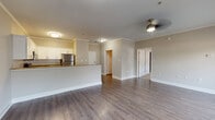 Located at 59 Anderson Ave in Canton, Georgia, this single-floor residence offers a thoughtfully designed open-concept layout that seamlessly connects the living and kitchen areas. The main living space features warm hardwood-style flooring, crown molding, and a ceiling fan, creating a bright and welcoming atmosphere. Natural light filters in through windows dressed with horizontal blinds, enhancing the sense of openness throughout.

The kitchen is a standout feature, showcasing rich granite countertops, crisp white shaker cabinetry with brushed nickel hardware, a classic subway tile backsplash, and a full suite of stainless steel appliances including a range, microwave, dishwasher, and refrigerator. A peninsula with an integrated sink adds both functionality and a natural division between the kitchen and living area.

The bedrooms are carpeted for comfort and each includes a ceiling fan, generous closet space, and windows that invite natural light. The bathroom continues the home's clean aesthetic with matching granite-topped white cabinetry, hardwood-style flooring, and a tub-shower combination. Throughout, neutral tones and consistent finishes create a cohesive, move-in-ready environment suited for comfortable everyday living.