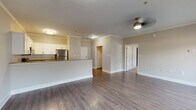 Located at 59 Anderson Ave in Canton, Georgia, this single-floor residence offers a thoughtfully designed open-concept layout that seamlessly connects the living and kitchen areas. The main living space features warm hardwood-style flooring, crown molding, and a ceiling fan, creating a bright and welcoming atmosphere. Natural light filters in through windows dressed with horizontal blinds, enhancing the sense of openness throughout.

The kitchen is a standout feature, showcasing rich granite countertops, crisp white shaker cabinetry with brushed nickel hardware, a classic subway tile backsplash, and a full suite of stainless steel appliances including a range, microwave, dishwasher, and refrigerator. A peninsula with an integrated sink adds both functionality and a natural division between the kitchen and living area.

The bedrooms are carpeted for comfort and each includes a ceiling fan, generous closet space, and windows that invite natural light. The bathroom continues the home's clean aesthetic with matching granite-topped white cabinetry, hardwood-style flooring, and a tub-shower combination. Throughout, neutral tones and consistent finishes create a cohesive, move-in-ready environment suited for comfortable everyday living.