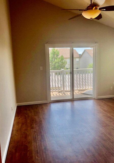Living room with slider to balcony. - 4302 Spring Creek Ln