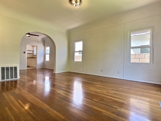 View from front door entrance looking into living room, dining room, and beyond that is the kitchen. - 545 N Vista St