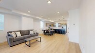 Located at 2962 Spanish Valley Dr in Moab, Utah, this contemporary 5-bedroom, 4-bathroom home spans three floors with a clean, modern aesthetic throughout. Light wood flooring runs seamlessly across all levels, complementing the crisp white walls and minimalist design sensibility.

The main level features an open-concept kitchen and living area, where a striking navy blue island with a white quartz countertop serves as the centerpiece. Natural wood cabinetry, open shelving, stainless steel appliances, and globe pendant lights complete the well-appointed kitchen. The adjacent living area offers generous space for relaxing and entertaining, with a sliding glass door that opens to one of two outdoor patio areas.

The five bedrooms are distributed across the three floors, each offering bright natural light through slatted blinds and ample closet storage — including walk-in and double-door closets. The primary bedroom is comfortably sized with its own dedicated closet space.

The four bathrooms echo the home's modern design, featuring warm wood vanities with white countertops, matte black fixtures, oval globe sconces, and a combination of shower-tub and standalone configurations.

Additional highlights include two staircases connecting the floors, multiple hallways, a balcony, and two patios — ideal for enjoying the scenic Moab surroundings.