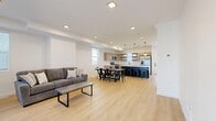 Located at 2962 Spanish Valley Dr in Moab, Utah, this contemporary 5-bedroom, 4-bathroom home spans three floors with a clean, modern aesthetic throughout. Light wood flooring runs seamlessly across all levels, complementing the crisp white walls and minimalist design sensibility.

The main level features an open-concept kitchen and living area, where a striking navy blue island with a white quartz countertop serves as the centerpiece. Natural wood cabinetry, open shelving, stainless steel appliances, and globe pendant lights complete the well-appointed kitchen. The adjacent living area offers generous space for relaxing and entertaining, with a sliding glass door that opens to one of two outdoor patio areas.

The five bedrooms are distributed across the three floors, each offering bright natural light through slatted blinds and ample closet storage — including walk-in and double-door closets. The primary bedroom is comfortably sized with its own dedicated closet space.

The four bathrooms echo the home's modern design, featuring warm wood vanities with white countertops, matte black fixtures, oval globe sconces, and a combination of shower-tub and standalone configurations.

Additional highlights include two staircases connecting the floors, multiple hallways, a balcony, and two patios — ideal for enjoying the scenic Moab surroundings.