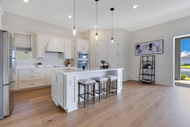 Building Photo - Waterfront Luxury in Isles of Lake Nona | 3-Car Garage, Resort Amenities & HOA-Included Cable, In...