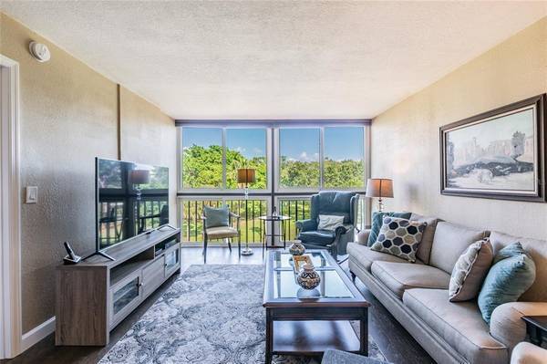 Living room view of 9th tee - 800 Cove Cay Dr