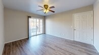 This 790 square foot single-story residence in Ozark, MO, offers a well-planned layout with 2 bedrooms and 2 bathrooms. The home features an open-concept design, combining the kitchen and living room for a spacious feel. The primary bedroom, measuring 170 square feet, provides ample space for relaxation.

Throughout the home, modern finishes are evident, including sleek ceiling fans, wood-look vinyl flooring in the main living areas, and plush carpeting in the bedrooms. The kitchen boasts light wood cabinetry, contrasting countertops, and white appliances, creating a bright and functional cooking space.

Large windows and sliding glass doors in the living area allow natural light to flood the interior, while also offering outdoor views. The bathrooms feature single vanities with wood cabinets and simple, clean designs. Built-in closets and a separate laundry room provide practical storage solutions.

The neutral color palette, predominantly in shades of white and beige, creates a fresh and versatile backdrop for various decor styles. This efficient home combines comfort and functionality, making it an ideal choice for those seeking a low-maintenance living space in a suburban setting.