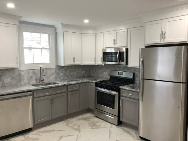 Kitchen - 2 tone cabinet - Carrara Granite counter Top - 16 Avenue E