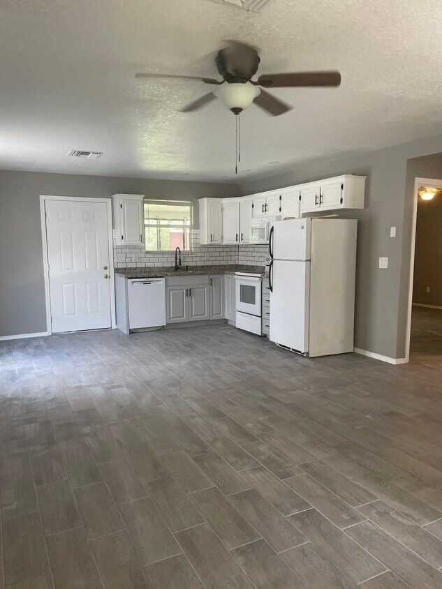 Newly decorated living room open concept kitchen - 7069 S Threshold Pt