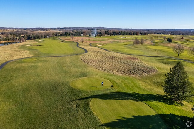 A golfer tees off at Washington County Golf Course in Hartford.