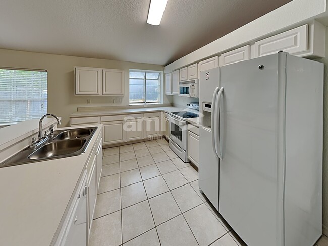 Foto del edificio - 13815 Riverpath Grove Dr