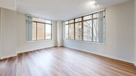 Located at 1855 St Francis St in Reston, VA, this single-floor residence offers 3 bedrooms and 3 bathrooms within a thoughtfully designed layout. The open-concept living, dining, and kitchen area serves as the heart of the home, bathed in natural light through large floor-to-ceiling windows. The kitchen is well-appointed with white shaker cabinetry, quartz countertops, a subway tile backsplash, stainless steel appliances including a gas range and dishwasher, and an island with a built-in sink. Hardwood-style flooring runs throughout the main living areas, adding warmth and continuity. The bedrooms offer comfortable retreats; secondary bedrooms feature plush carpeting and windows with outdoor views, while the spacious primary bedroom provides a generous footprint. Each of the three bathrooms is finished in a clean, modern style, with the full bathrooms featuring tiled tub-shower combinations, white vanities, and wood-look flooring. Additional conveniences include five closets, dedicated laundry, utility rooms, and a private patio. A connecting hallway ties the layout together efficiently, making the most of the well-proportioned floor plan.