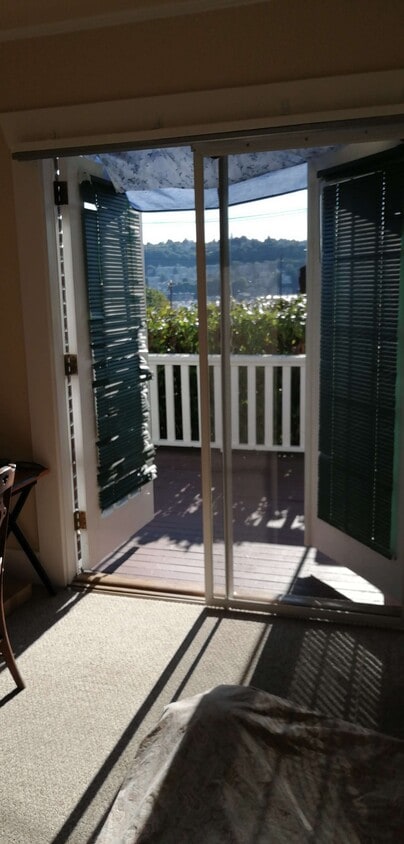 bedroom 1, French doors lead to deck and the lake/tree top view - 2315 Yale Ave E